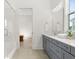 Bathroom with glass shower and gray double vanity offers a spa-like experience at 509 Rhythm St, Summerville, SC 29486