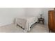 Cozy bedroom setup with a bed, side table and wooden dresser at 509 Rhythm St, Summerville, SC 29486