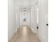 Bright hallway featuring wood floors, modern lighting, and an inviting front door at 509 Rhythm St, Summerville, SC 29486