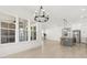 Bright living room with an abundance of natural light, hardwood flooring, and modern chandelier at 509 Rhythm St, Summerville, SC 29486
