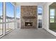 Screened patio features a brick fireplace and views of the surrounding neighborhood at 509 Rhythm St, Summerville, SC 29486