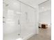 Modern glass shower with white subway tile and seat in a well-lit bathroom at 509 Rhythm St, Summerville, SC 29486