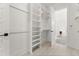 Large walk-in closet with wooden racks and shelves providing plenty of storage space at 509 Rhythm St, Summerville, SC 29486