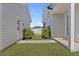 Well-maintained backyard featuring lush lawn, walkway, and white siding at 509 Rhythm St, Summerville, SC 29486