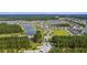 Aerial view of a community with homes, lakes, schools, parks, recreation areas, and roads at 511 Verdi Dr, Summerville, SC 29486