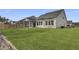 View of the home's backyard showing the lawn, fence, screened in porch, and the home's exterior at 511 Verdi Dr, Summerville, SC 29486