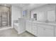 Bathroom featuring double vanity, walk-in shower, and a separate soaking tub at 511 Verdi Dr, Summerville, SC 29486
