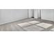 Empty bedroom showcasing neutral carpet, natural light, and multiple doors for ample closet space at 511 Verdi Dr, Summerville, SC 29486