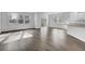 Open-concept living room with hardwood floors, a sliding door, and seamless transition into the kitchen area at 511 Verdi Dr, Summerville, SC 29486
