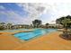 Large community pool featuring water features, lounge chairs, and covered seating areas at 511 Verdi Dr, Summerville, SC 29486