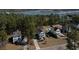 An aerial view of lovely homes with a waterfront marsh in the distance showcases neighborhood amenities and natural beauty at 520 Sanders Farm Ln, Wando, SC 29492