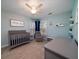 Charming Bedroom features a gray crib, rocker and soothing color palette at 520 Sanders Farm Ln, Wando, SC 29492