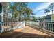 Spacious wooden deck perfect for entertaining with a view of the backyard and pool at 520 Sanders Farm Ln, Wando, SC 29492
