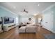 Open-concept living room is complete with modern furnishings, sleek flooring, and neutral color palette at 520 Sanders Farm Ln, Wando, SC 29492