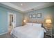 Comfortable main bedroom with ensuite bathroom featuring a walk-in shower at 520 Sanders Farm Ln, Wando, SC 29492