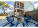 Outdoor patio area with modern firepit and adirondack chairs at 520 Sanders Farm Ln, Wando, SC 29492