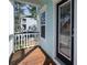 Cozy porch showcases a wooden floor, a door to get inside, and provides a quiet view of the neighborhood at 520 Sanders Farm Ln, Wando, SC 29492