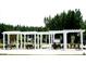 Exterior view of the amenity center with covered seating areas and landscaping at 525 Verdi Dr, Summerville, SC 29486