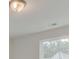 Well lit bedroom with a view of the neighborhood through two large windows at 525 Verdi Dr, Summerville, SC 29486