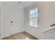 Bright entryway features a white door, hardwood floors, and a window allowing natural light at 525 Verdi Dr, Summerville, SC 29486