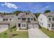 Beautiful two-story home boasts a brick facade, two-car garage, and a well-manicured lawn at 525 Verdi Dr, Summerville, SC 29486