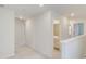 Hallway with neutral carpet, white walls, and doors leading to various rooms at 525 Verdi Dr, Summerville, SC 29486