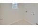 A laundry room with tile floor, window, and hookups for washer and dryer at 525 Verdi Dr, Summerville, SC 29486