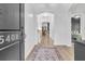 Bright foyer features hardwood floors, a decorative rug, and an arched entryway at 5408 Overland Trl, North Charleston, SC 29420