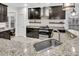 Modern kitchen with stainless steel appliances, granite countertops, and stylish lighting at 5408 Overland Trl, North Charleston, SC 29420