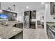 Modern kitchen with stainless steel appliances, dark cabinetry, and granite countertops at 5408 Overland Trl, North Charleston, SC 29420
