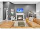 Cozy living room with a fireplace, comfortable seating, and stylish decor elements at 5408 Overland Trl, North Charleston, SC 29420