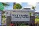 Waterside at the Lakes of Cane Bay community entrance sign with lush landscaping and serene setting at 552 Richfield Way, Summerville, SC 29486