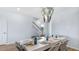 Formal dining room features a modern light fixture and seating for six, creating an elegant space for entertaining at 552 Richfield Way, Summerville, SC 29486