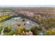 An aerial capture of a secluded home with pool, offering serene privacy amidst a sprawling wooded terrain at 5529 Golden Rice Ln, Ravenel, SC 29470