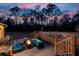 The backyard has a cozy seating area with a fire pit and a pool, ideal for outdoor enjoyment at 5529 Golden Rice Ln, Ravenel, SC 29470