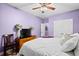 Bedroom featuring carpet flooring, light purple walls and a dresser with television on it at 5529 Golden Rice Ln, Ravenel, SC 29470