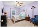 Bedroom featuring carpet flooring, light purple walls and a white bed frame at 5529 Golden Rice Ln, Ravenel, SC 29470