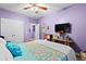 Bedroom featuring carpet flooring, light purple walls and a colorful bedspread at 5529 Golden Rice Ln, Ravenel, SC 29470