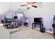 Bedroom with a sofa, large windows, and an entertainment center at 5529 Golden Rice Ln, Ravenel, SC 29470