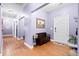 A lovely home entryway featuring hardwood floors and a bench at 5529 Golden Rice Ln, Ravenel, SC 29470