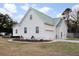 Well-maintained home with a metal roof and attached garage at 5529 Golden Rice Ln, Ravenel, SC 29470