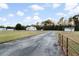 Lovely country home featuring a metal roof, long driveway, and spacious front yard at 5529 Golden Rice Ln, Ravenel, SC 29470