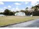 Charming home with a metal roof and well-maintained front lawn at 5529 Golden Rice Ln, Ravenel, SC 29470