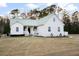 Charming home with metal roof, inviting porch, and established landscaping at 5529 Golden Rice Ln, Ravenel, SC 29470