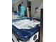 Hot tub with turquoise rocking chairs nearby on the deck at 5529 Golden Rice Ln, Ravenel, SC 29470