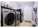 Laundry room with stainless steel washer and dryer at 5529 Golden Rice Ln, Ravenel, SC 29470