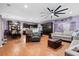 Spacious open-concept living area featuring hardwood floors and modern decor at 5529 Golden Rice Ln, Ravenel, SC 29470