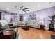 Open living room boasts hardwood floors, large sectional sofa, and stylish decor at 5529 Golden Rice Ln, Ravenel, SC 29470