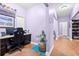 Home office features a built in desk and hardwood floors at 5529 Golden Rice Ln, Ravenel, SC 29470