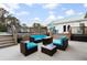 Outdoor patio with comfortable seating around a fire pit plus the backyard deck and dining area at 5529 Golden Rice Ln, Ravenel, SC 29470